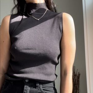 black sleeveless turtleneck